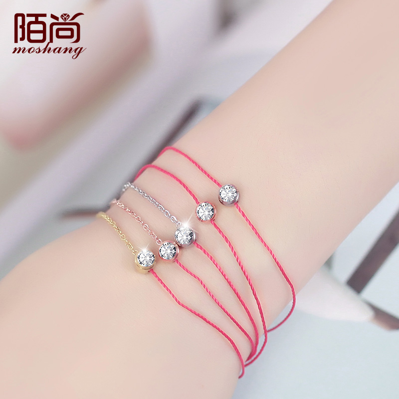 thin red string bracelet