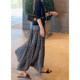 A V-neck suspender high-waist dress can be worn alone