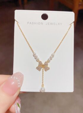 甜美小众轻奢首饰女2023年新款蝴蝶结珍珠项链吊坠锁骨链毛衣链