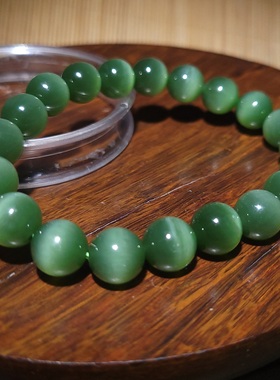 YQ011506新疆的猫31.7克直径10mm色调艳和田玉菠菜绿碧玉猫眼手链