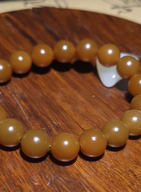 YQ121903 26.7克，10mm油糯细润色泽浓郁且末老红糖玉圆珠手串