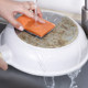 SOWA cleaning sponge wipes remove black dirt from the bottom of the pot