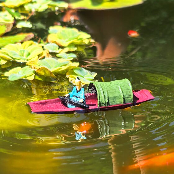 Antique mini floating boat ornaments that can be launched into the water