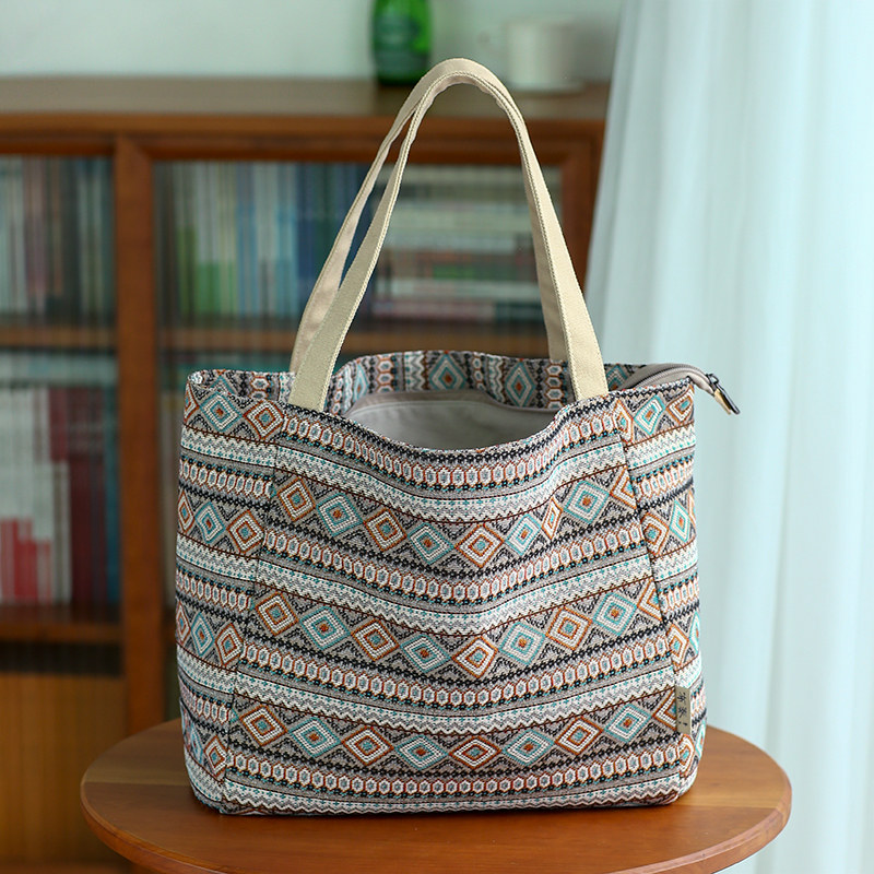 布奏提花包包女托特包大容量春夏手提帆布包女2023新款通勤上班族 - 图1