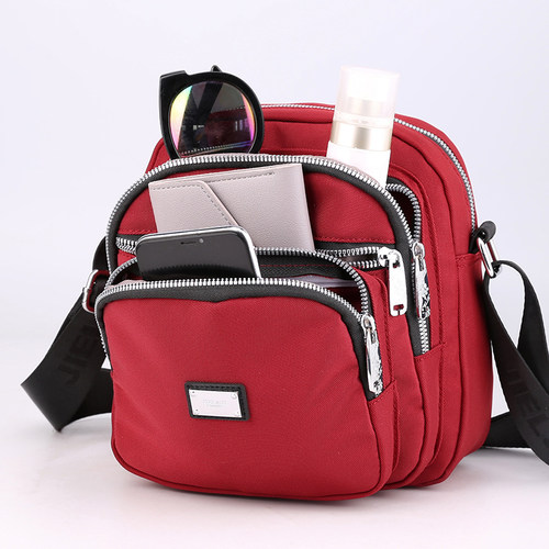 斜挎牛津布女包轻便妈妈包防水尼龙包包新款2025网红多层单肩小包 - 图1