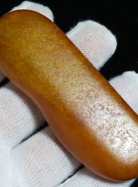 已售67.6克和田玉黄沁籽料原石把件长条状一口气毛孔清晰无伤无裂