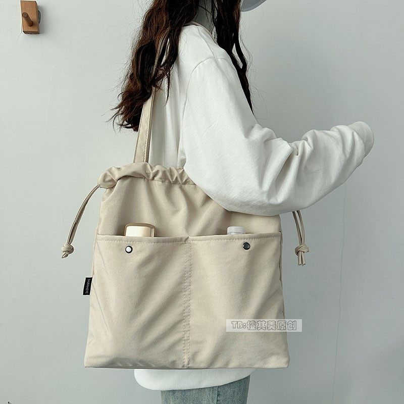 轻便防水尼龙布包包女秋冬2025新款抽绳单肩托特包通勤上学装书包,淘宝优惠券,粉丝福利购,淘宝优惠卷