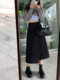 Irregular and versatile A-line asymmetric mid-length skirt for women