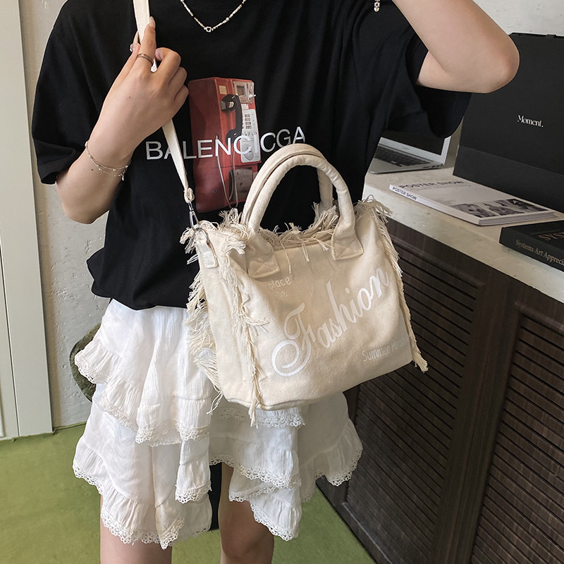 帆布包包2025新款秋冬韩版流苏时尚通勤包大容量手提包单肩斜挎包,淘宝优惠券,粉丝福利购,淘宝优惠卷