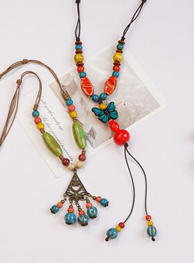 复古民族风陶瓷蝴蝶铃铛吊坠项链女设计感新款潮长款毛衣链配饰品
