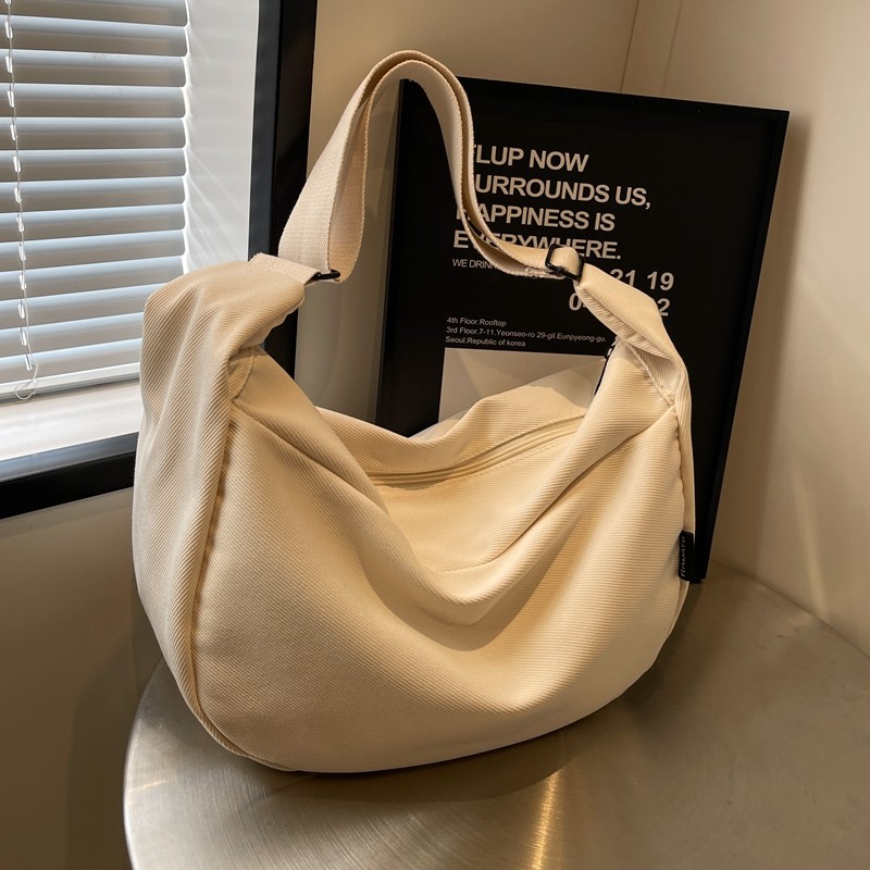 大容量帆布包女2025新款休闲宽带单肩斜挎包上课通勤包百搭饺子包,淘宝优惠券,粉丝福利购,淘宝优惠卷