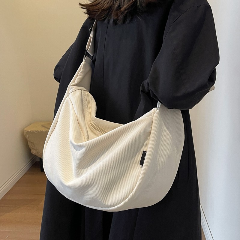 大容量帆布包女2025新款休闲宽带单肩斜挎包上课通勤包百搭饺子包,淘宝优惠券,粉丝福利购,淘宝优惠卷