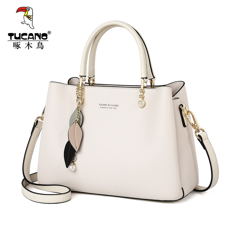 啄木鸟女士2021新款2022手提斜挎包 啄木鸟鑫星女士包袋