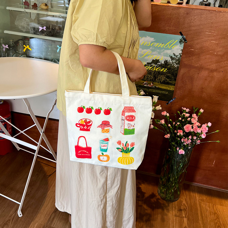 手提帆布包新款插画师联名学生通勤小拎包可爱饭盒袋百搭帆布袋,淘宝优惠券,粉丝福利购,淘宝优惠卷