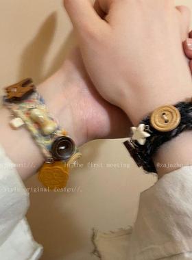 黑色小熊铃铛纽扣手绳女秋冬