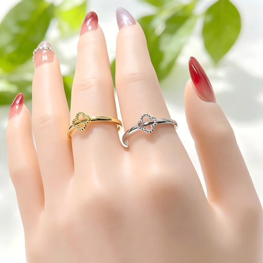 Non-fading, high-end light luxury temperament four-leaf clover hollow titanium steel ring for women 18K gold trendy versatile plain ring