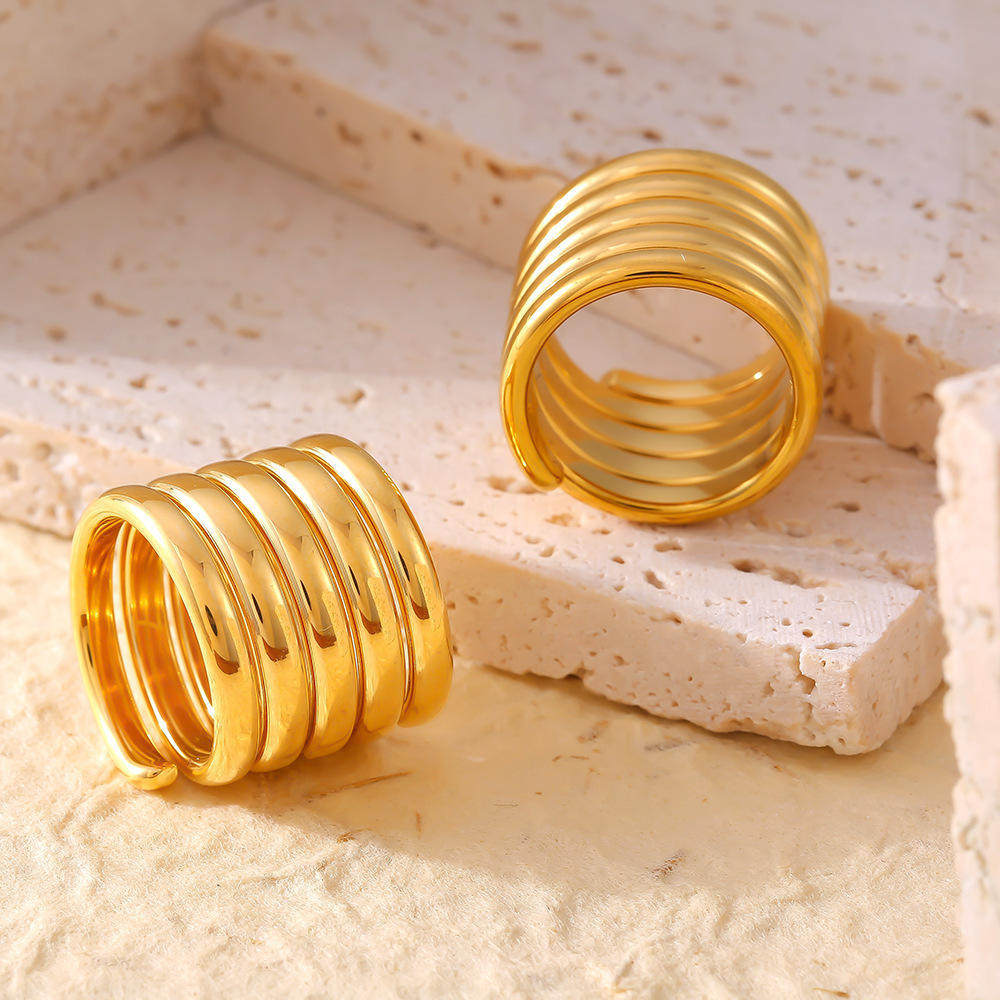 Cross-border European and American niche design multi-layer winding wide version ring for women with light luxury texture titanium steel plated 18k gold ring