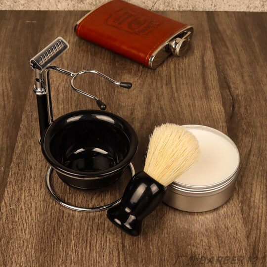 Old-fashioned razor for beard shaving and foam beating for men