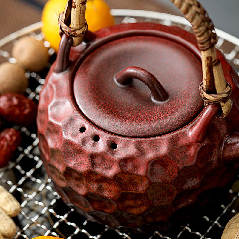 Ceramic teapot for making tea around the stove