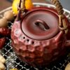 Ceramic teapot for making tea around the stove
