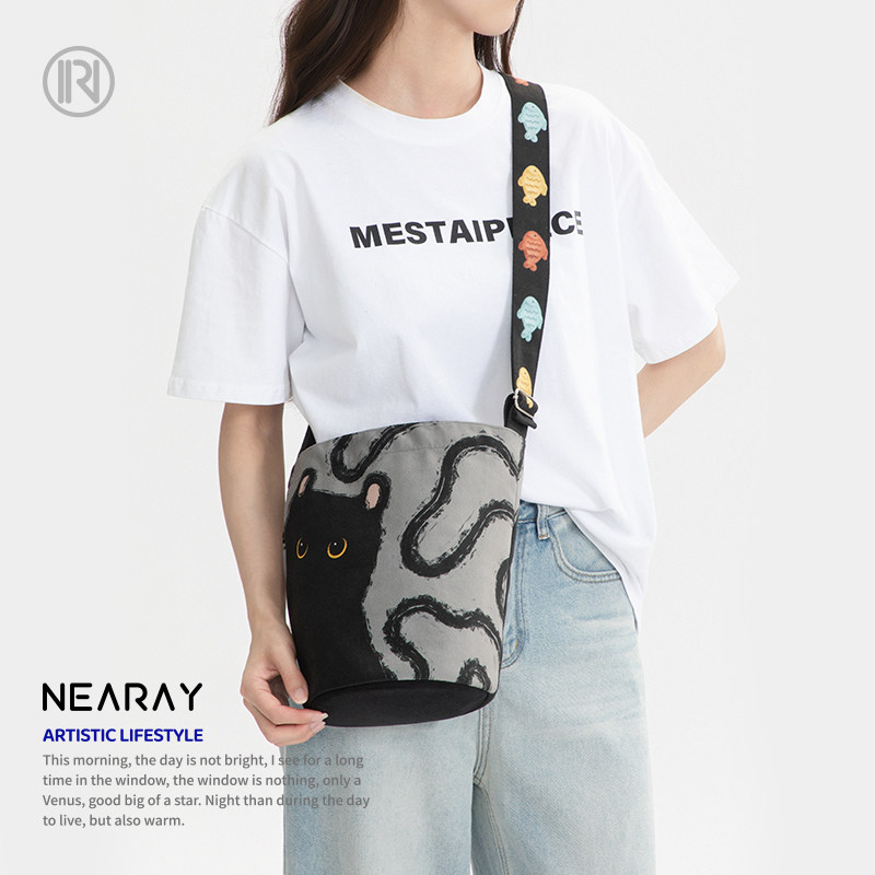 尼睿2025新款包包女可爱猫咪水桶包单肩包斜挎包手提小众通勤包Z6,淘宝优惠券,粉丝福利购,淘宝优惠卷