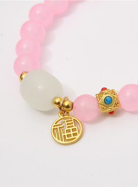Crystal beaded bracelet with female lucky character charm
