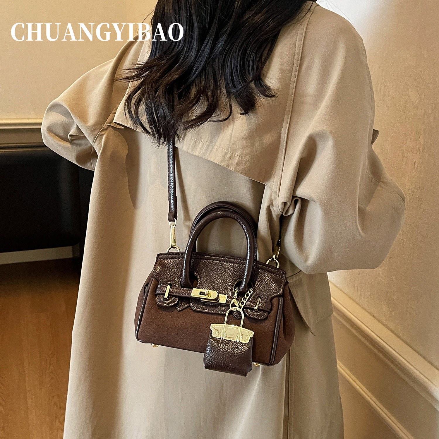 秋冬超火手提麂皮凯莉包包女2025新款轻奢小众高级感通勤斜挎小包,淘宝优惠券,粉丝福利购,淘宝优惠卷