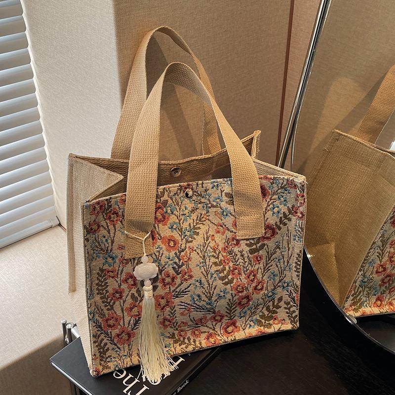 今年流行包包女2025新款麻布手提袋女ins上课通勤百搭碎花托特包,淘宝优惠券,粉丝福利购,淘宝优惠卷