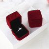 Simulated wedding rings and live props couple