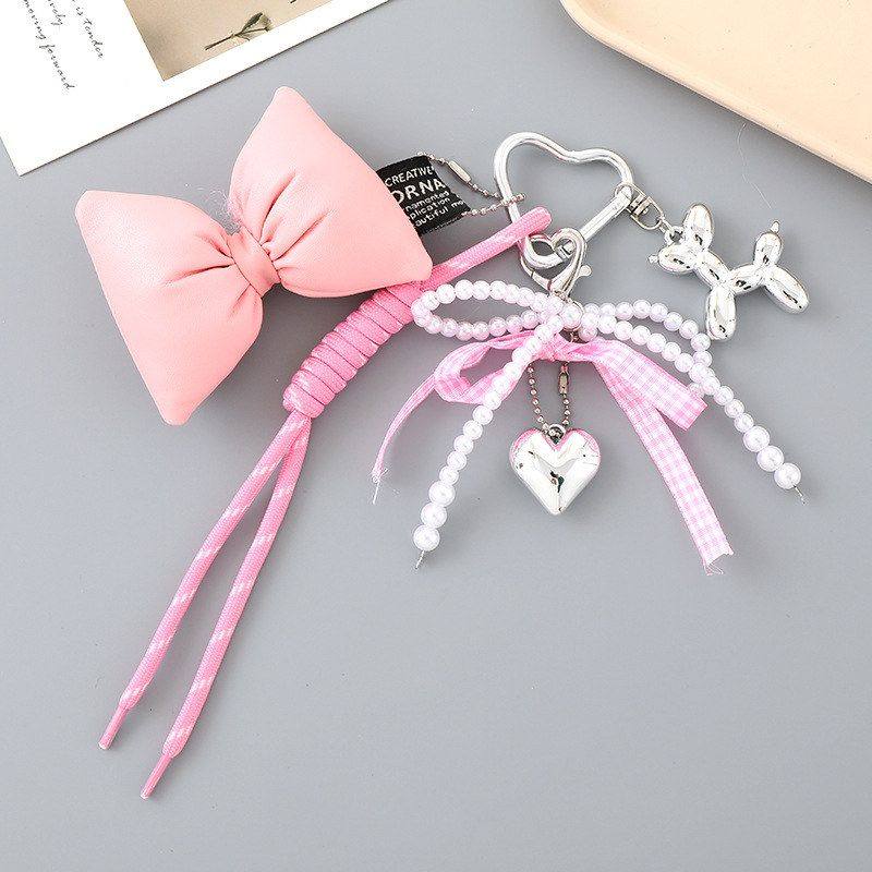 创意新款爱心珍珠蝴蝶结挂件miu系编织绳包包挂饰装饰品手机挂件,淘宝优惠券,粉丝福利购,淘宝优惠卷