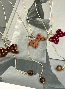 红色波点蝴蝶结抽拉项链秋冬小众设计可爱毛衣链超好看独特配饰