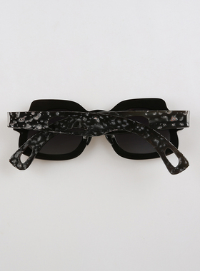 黑色牛角太阳眼镜不规则异形框陨石坑洼压花纹设计感镂空腿洞墨镜