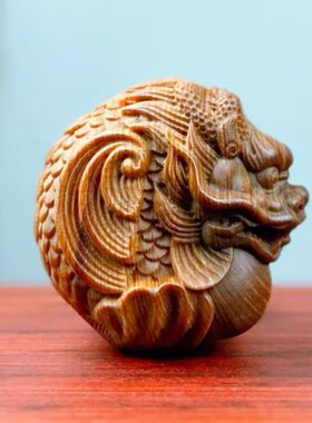 太行崖柏龙鱼手把件圆款