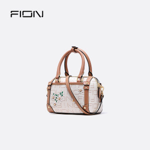 Fion/菲安妮女包专柜新款单肩斜挎包钉花抽带水桶包手提单肩包包