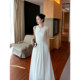 Maven Lin ຊຸດເສື້ອເຊີດທີ່ບໍ່ມີແຂນທີ່ຫລູຫລາແລະສູງສໍາລັບແມ່ຍິງທີ່ມີຄໍຮອບ, ເປີດ V ຂະຫນາດນ້ອຍ, ແອວແລະກະໂປງຍາວສີຂາວທີ່ສະຫງ່າງາມ