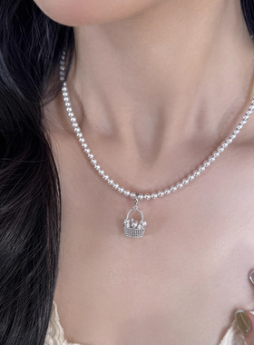 财篮子吊坠珍珠项链秋冬配饰女轻奢小众毛衣链感串珠颈链饰品