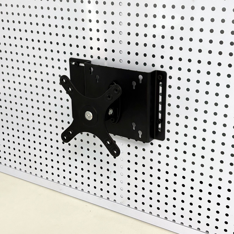 Perforated board computer screen stand saves space
