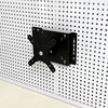 Perforated board computer screen stand saves space