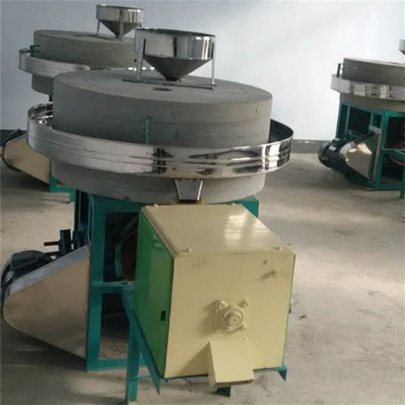 New type of wheat and cereal flour mill electric stone mill. Grain and cereal flour stone mill.