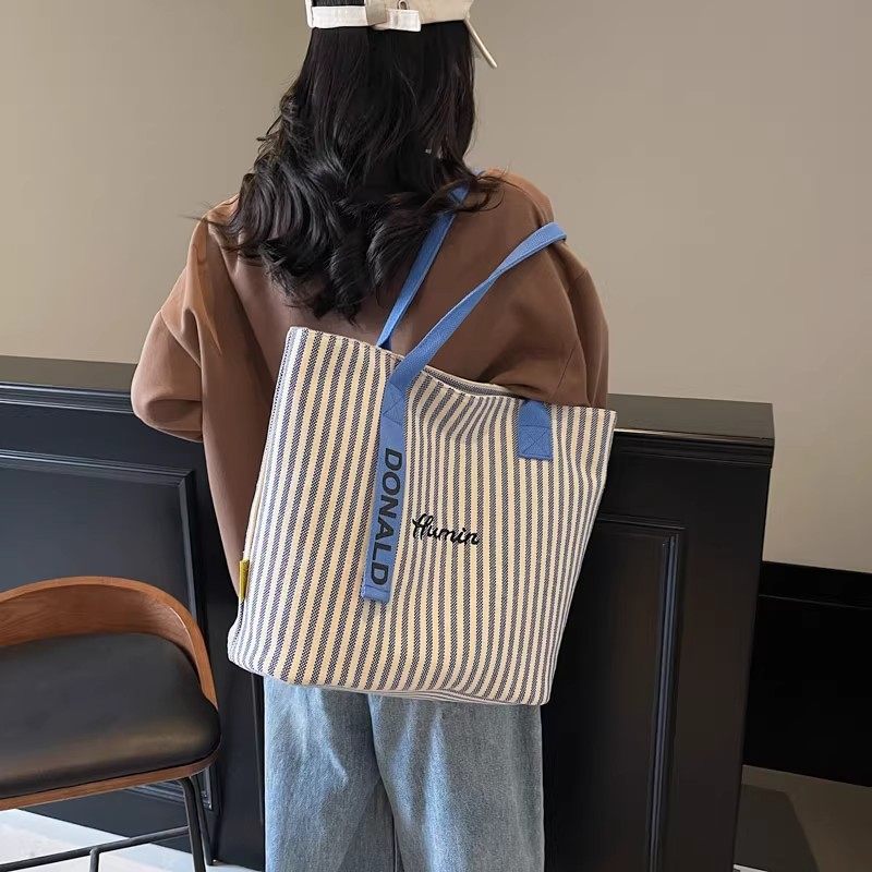 2025年春季女包大容量新款潮流单肩包简约手提休闲包撞色托特包女,淘宝优惠券,粉丝福利购,淘宝优惠卷