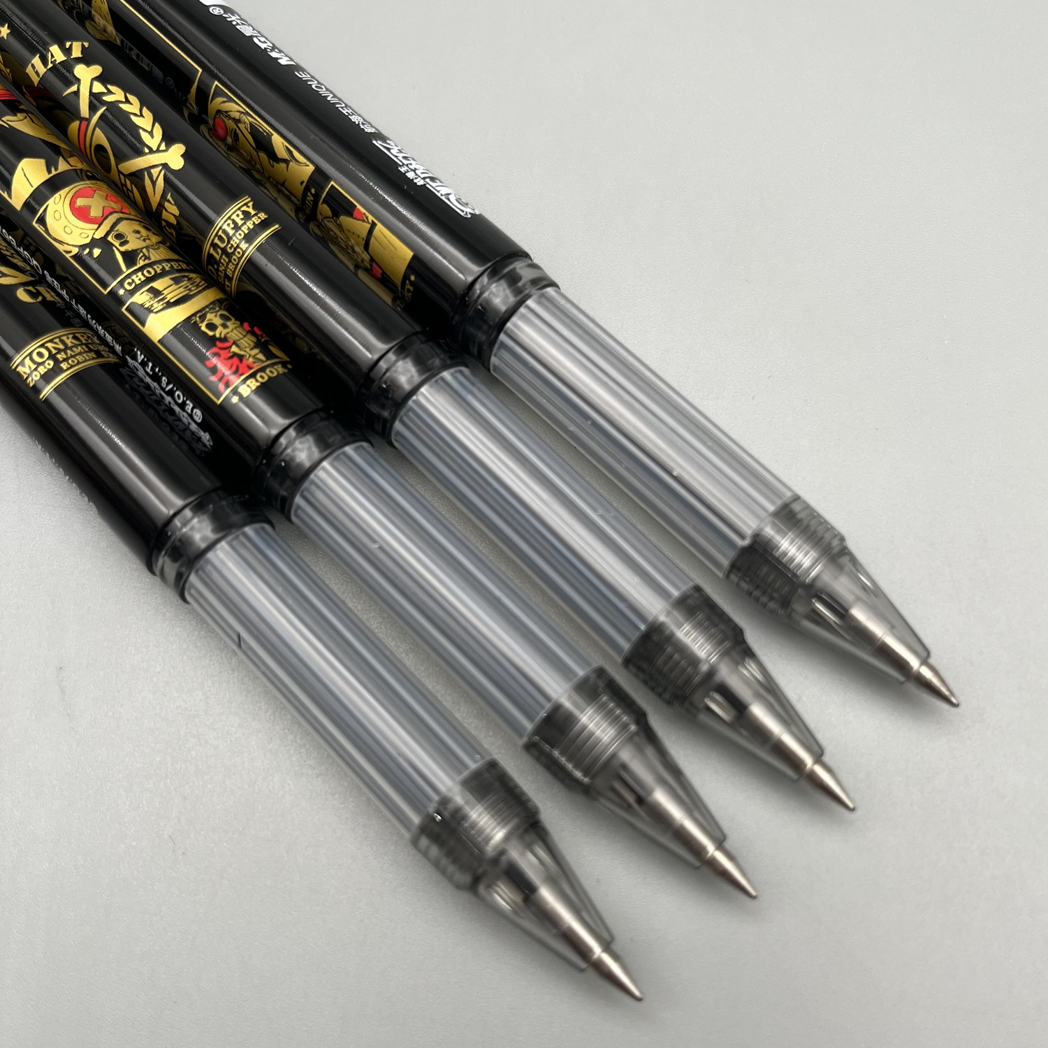 晨光航海王拔盖中性笔0.5mm黑色子弹头速干中空护套学生用笔记刷题作业考试办公高颜值动漫签字笔水笔B6702,淘宝优惠券,粉丝福利购,淘宝优惠卷