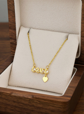跨境时尚LOVE字母镶钻钛钢项链女爱心流苏吊坠轻奢高级感女锁骨