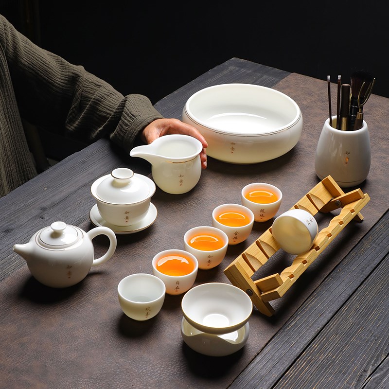 A complete set of mutton-fat jade white porcelain tea sets for home simple Chinese Kung Fu bubble H teapot cover bowl ceramic small teacup with cup