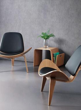 艺术实木休闲网红简约沙发椅子设计师阳台单人pu皮微笑飞机贝壳椅