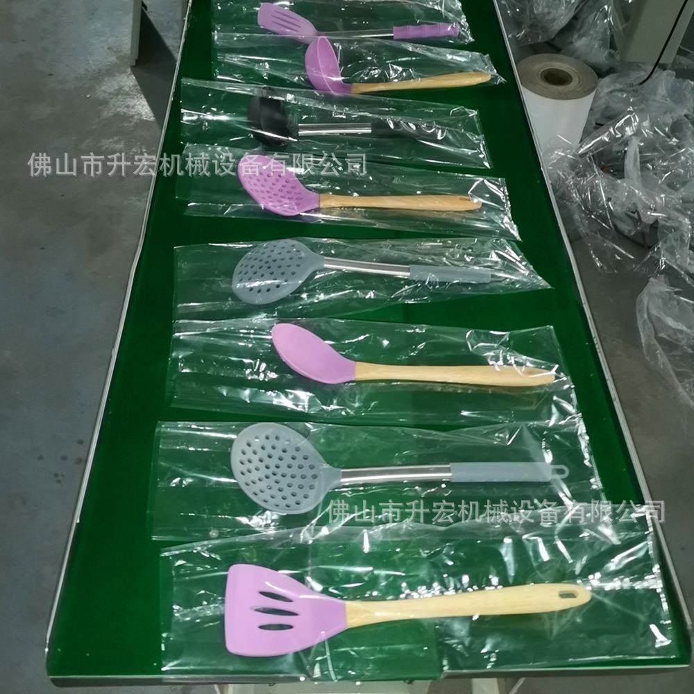 佛山包装机基地厨房勺子包装机漏勺封口机硅胶厨具自动包装机,淘宝优惠券,粉丝福利购,淘宝优惠卷