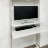 Perforated board bookshelf floating tabletop