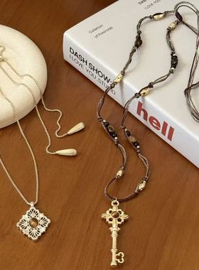 金色镂空菱形虎眼石钥匙吊坠项链女小众大气高档秋冬长款毛衣链