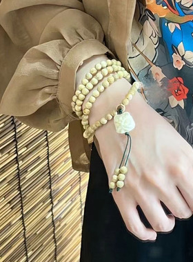 奶香木雕刻醒狮吊坠款多圈手串