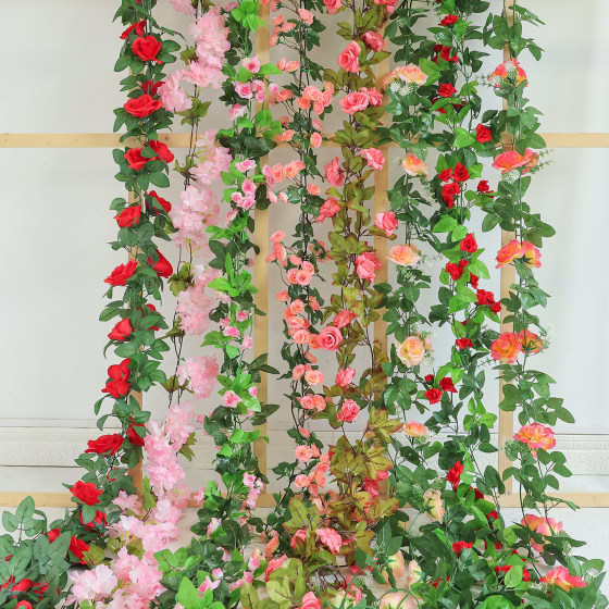 Butterfly wrapped around air conditioning water pipe plastic simulation rose