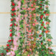 Butterfly wrapped around air conditioning water pipe plastic simulation rose